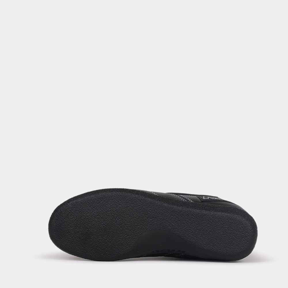 Semelle noire antidérapante de chaussures de boxe française de la marque Rivat pour performance optimale